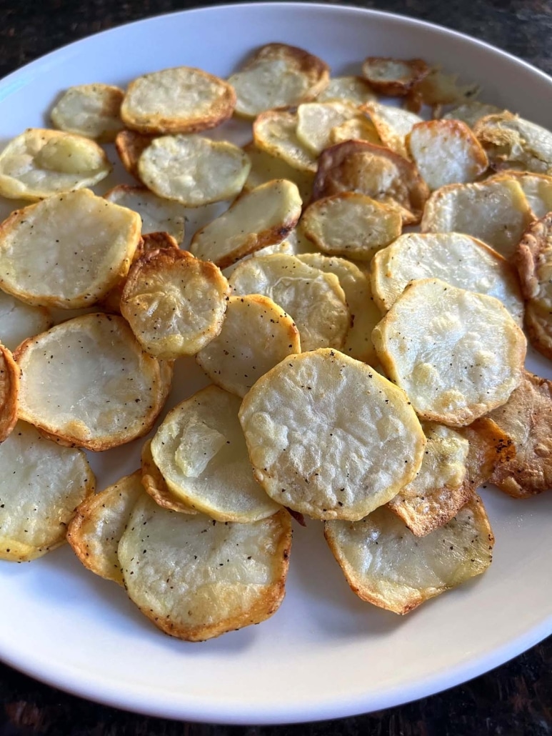 pile of lightly crispy Air Fryer Sliced Potatoes
