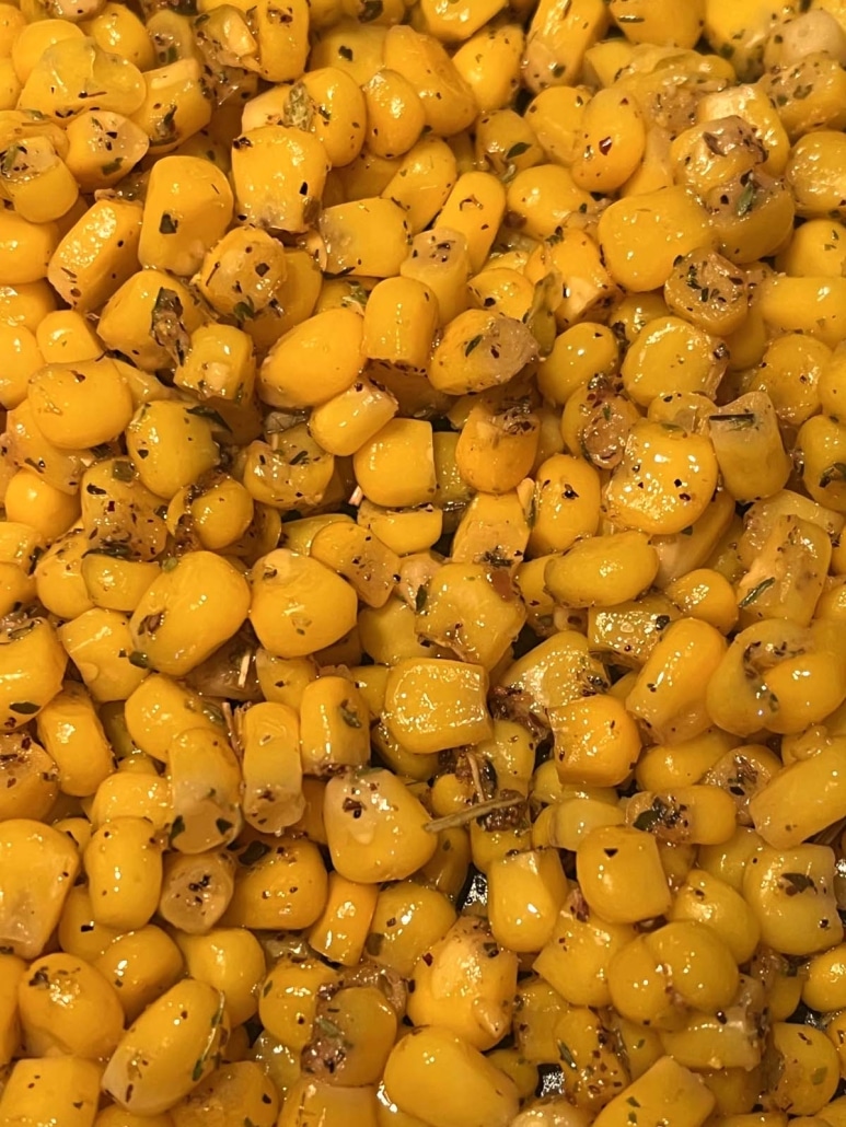 close-up of buttered, seasoned corn