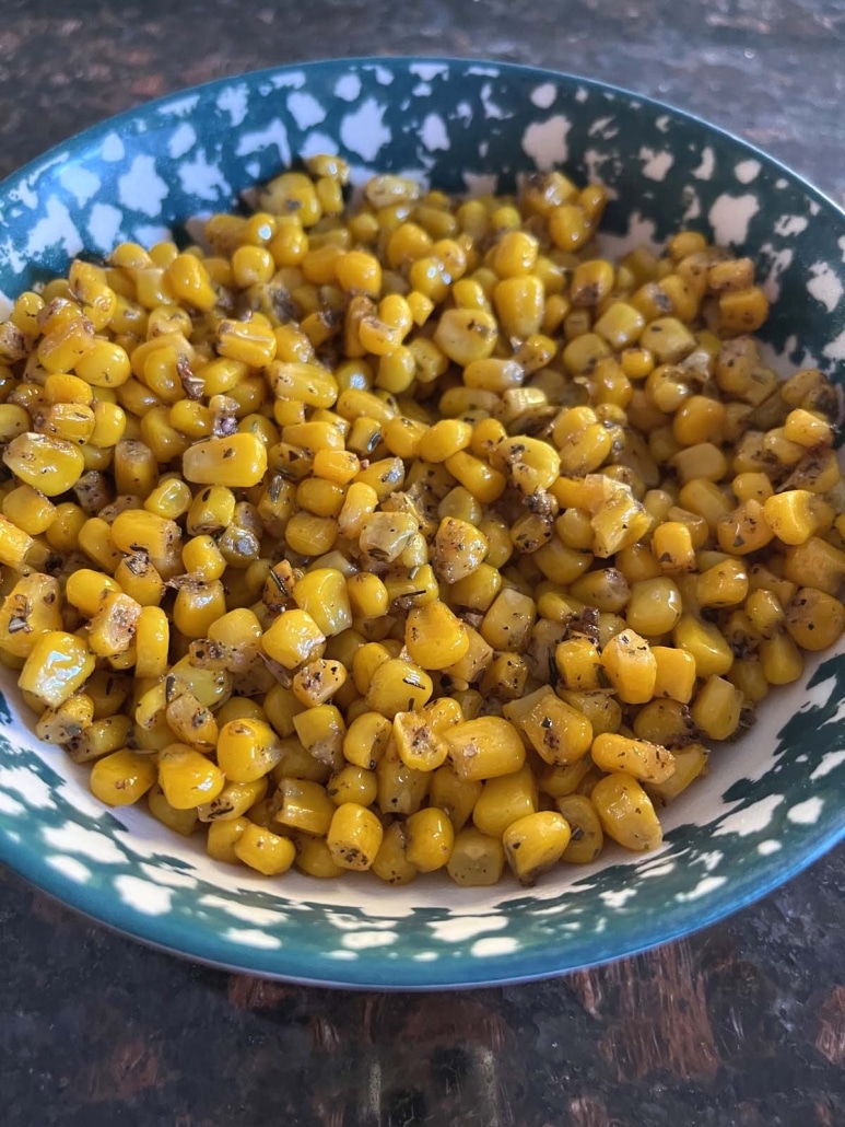 seasoned, cooked corn in a serving bowl