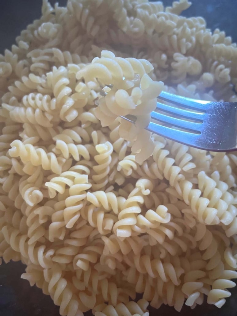 forkful of pasta cooked in the microwave