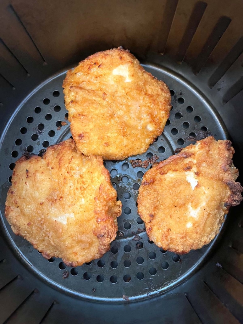 air fryer basket with golden brown Aldi red bag chicken fillets