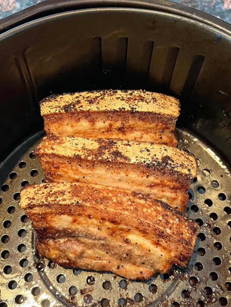 flavorful pork belly cooking in an air fryer