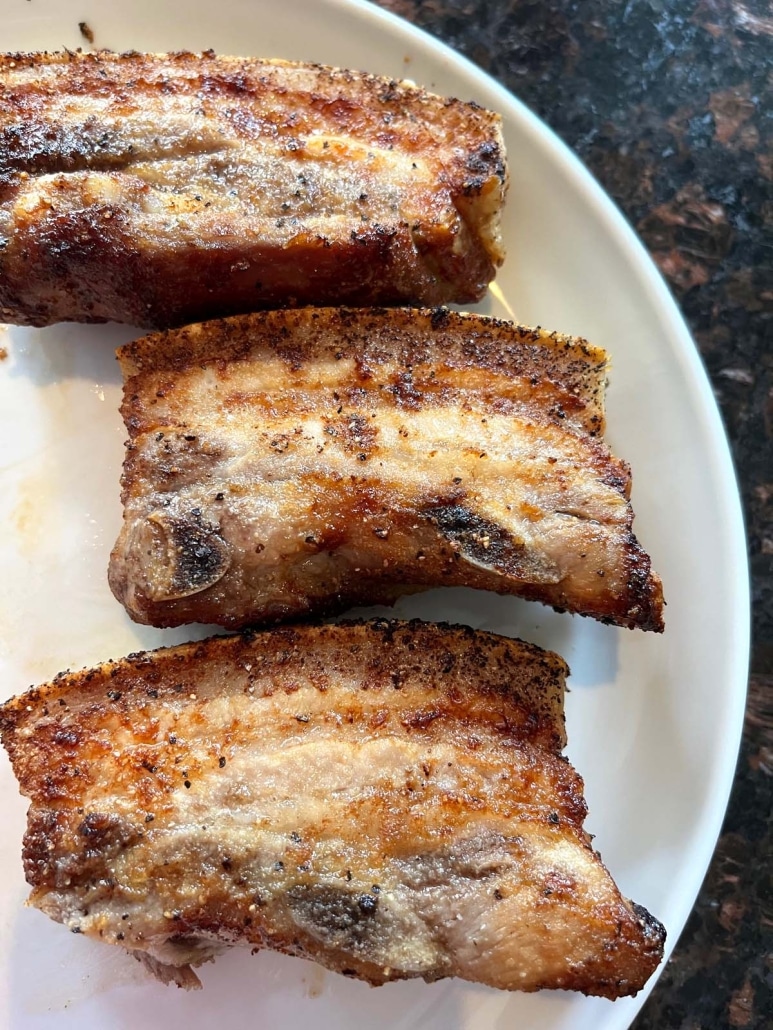crispy and tender Air Fryer Pork Belly pieces on a plate