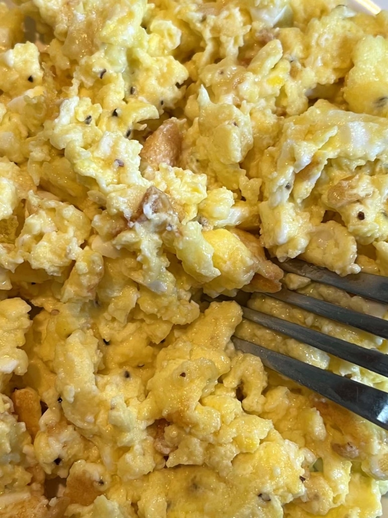 fork picking up Scrambled Eggs With Cottage Cheese