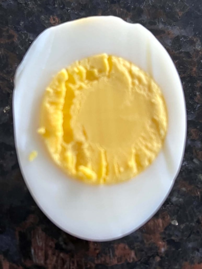 half of a hard boiled egg, cooked in the oven