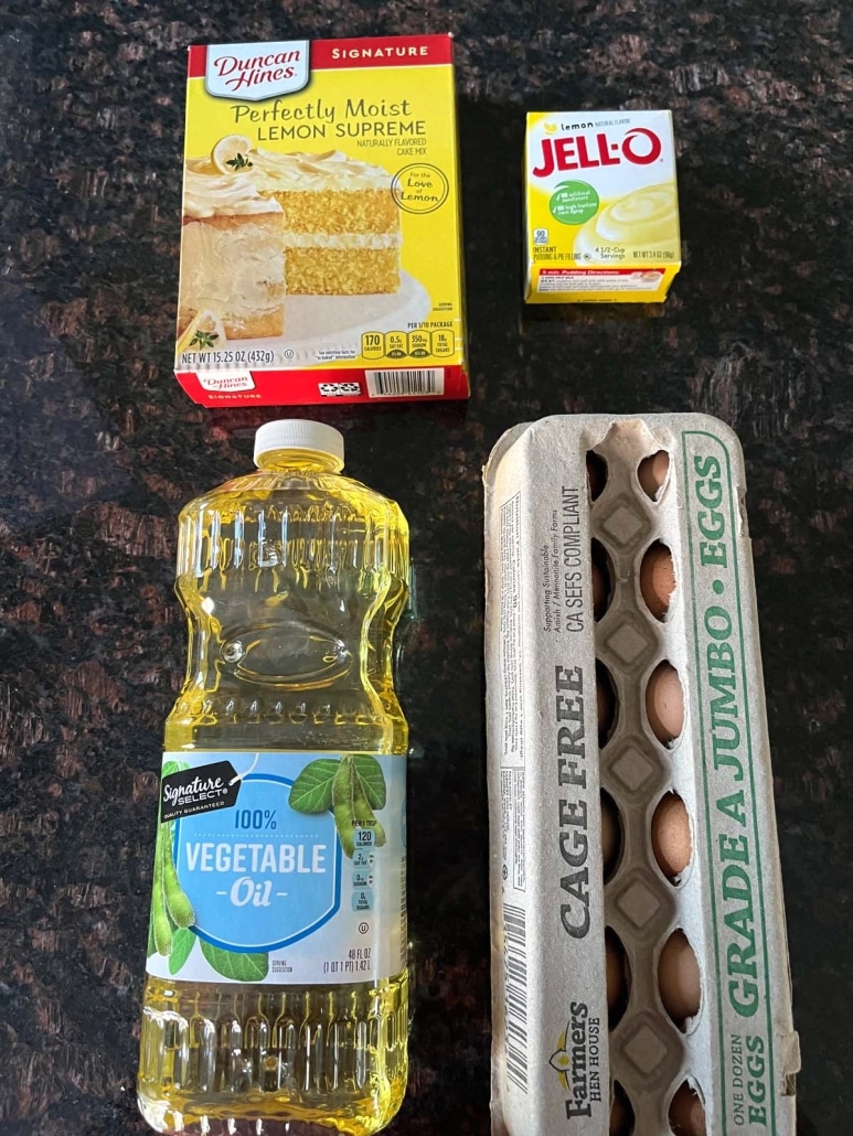 Ingredients to make lemon bundt cake: vegetable oil, eggs, Duncan Hines lemon cake mix, and Jello lemon pudding mix