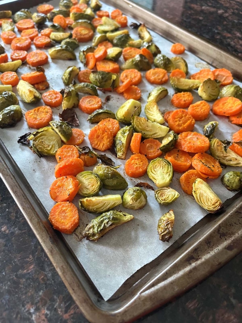 Roasted Brussels Sprouts And Carrots on a baking sheet