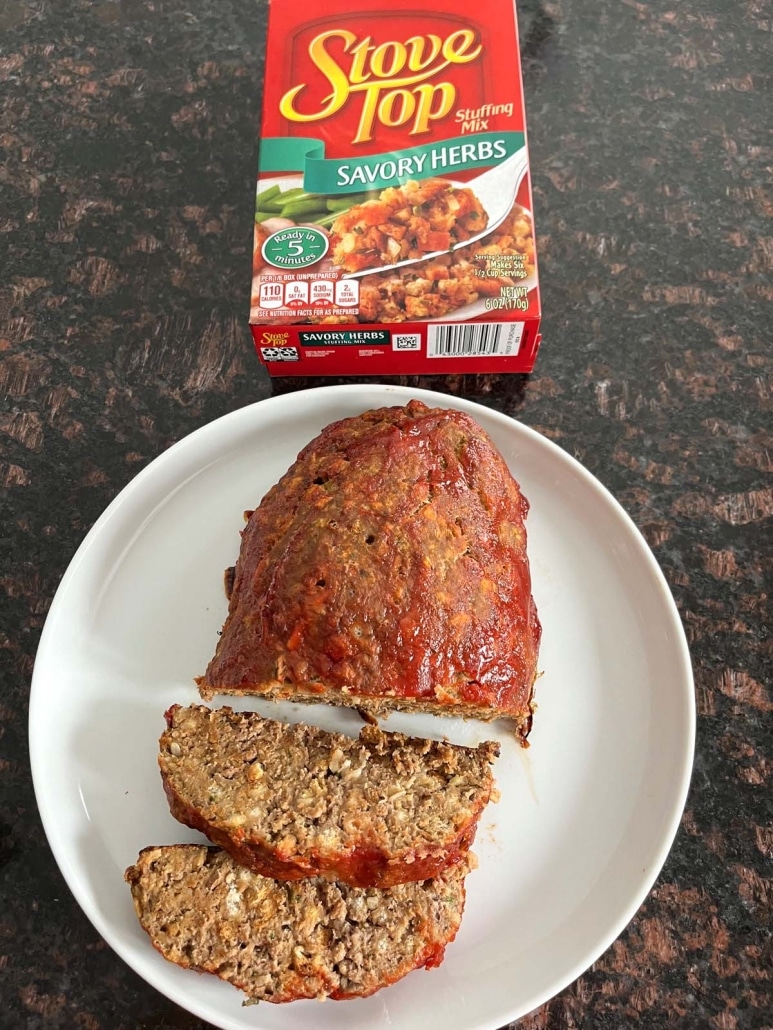 sliced Stove Top Stuffing Meatloaf next to a box of stuffing mix