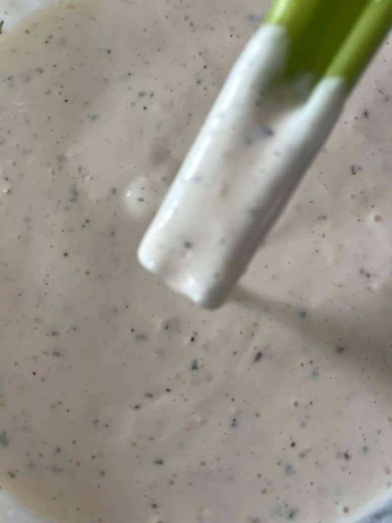 celery dipped in homemade ranch dressing made with buttermilk