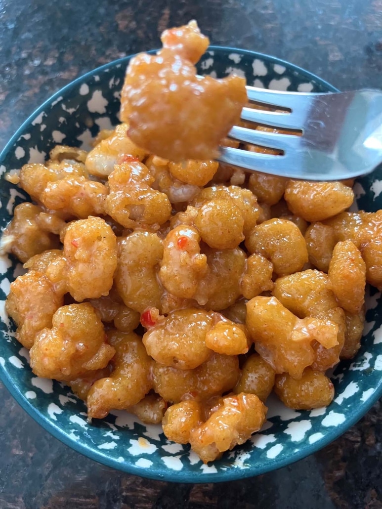 fork with bite of bang bang shrimp