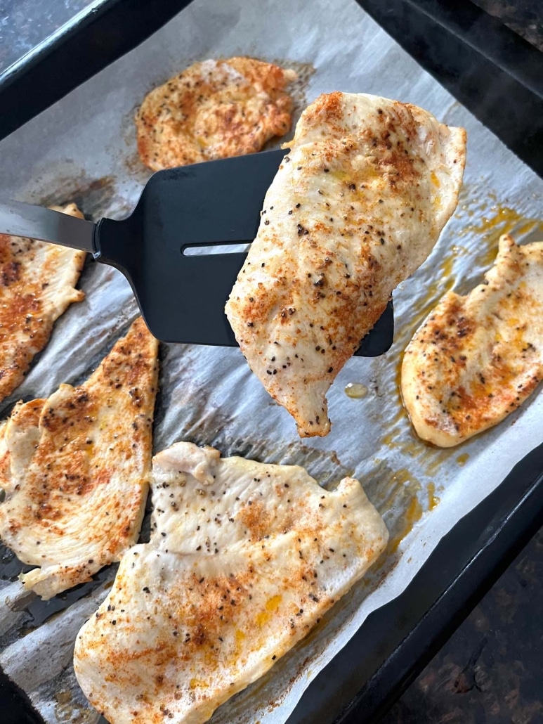 spatula holding up a Baked Chicken Cutlet
