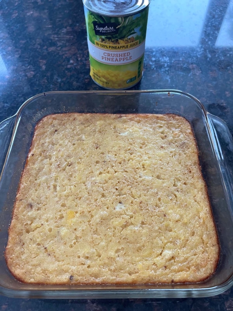 can of crushed pineapple next to a freshly baked Pineapple Bake Casserole