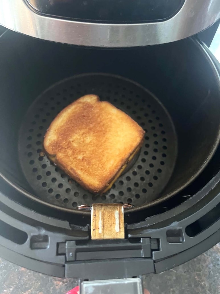 golden brown sandwich inside air fryer
