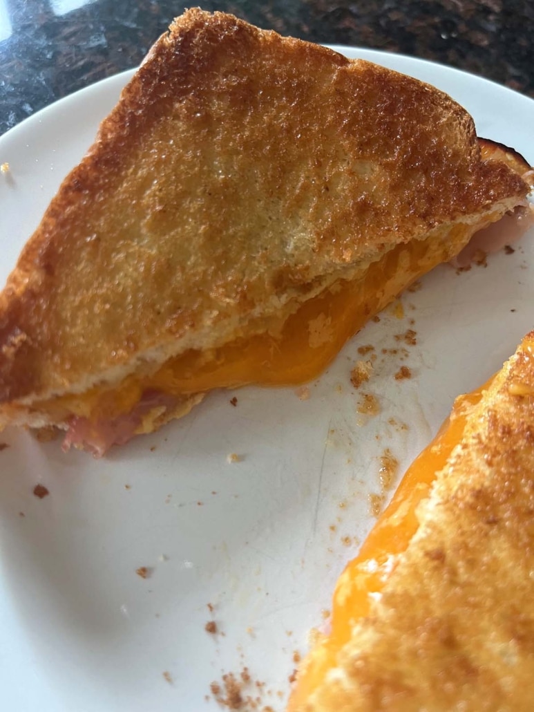 warm and crispy Air Fryer Grilled Ham And Cheese on a plate