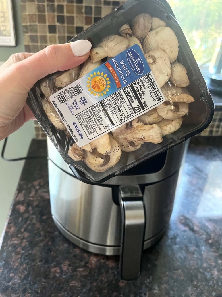 package of sliced mushrooms in front of an air fryer