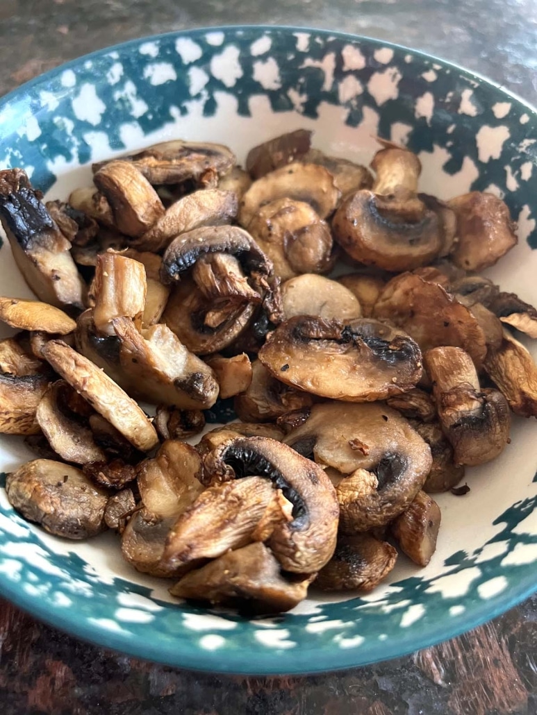 bowl of healthy topping sliced mushrooms