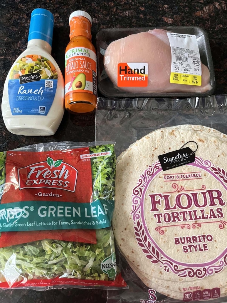 ingredients to make Buffalo Chicken Wrap: chicken, tortilla, lettuce, buffalo sauce, and ranch dressing
