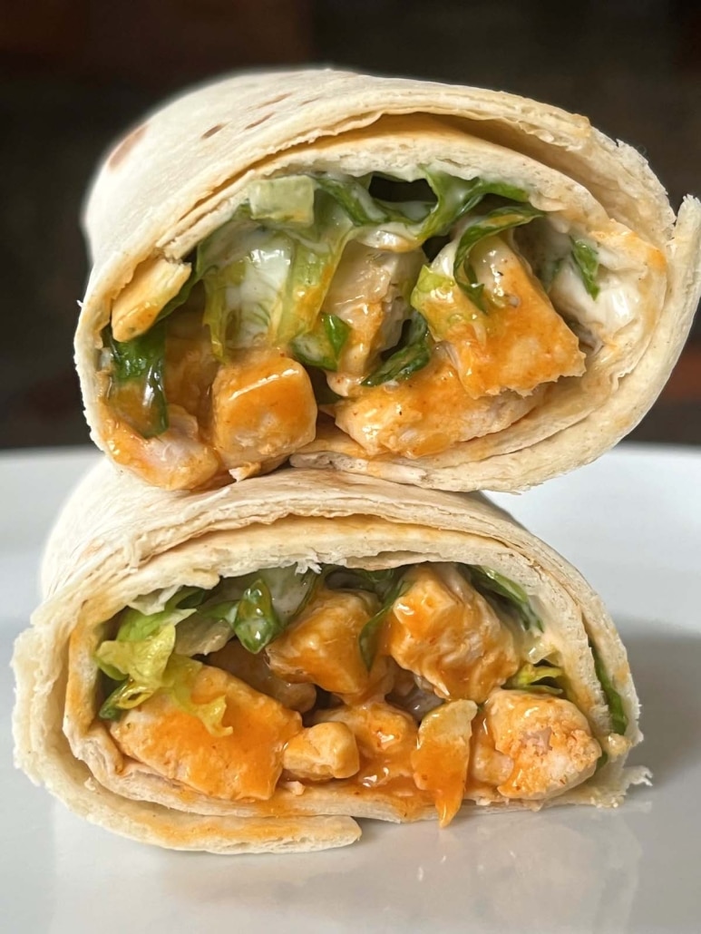two halves of a Buffalo Chicken Wrap on top of each other