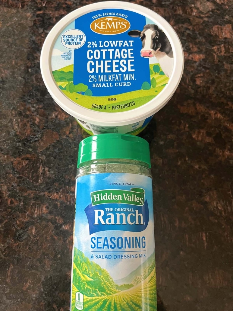 container of cottage cheese and container of ranch seasoning on a countertop
