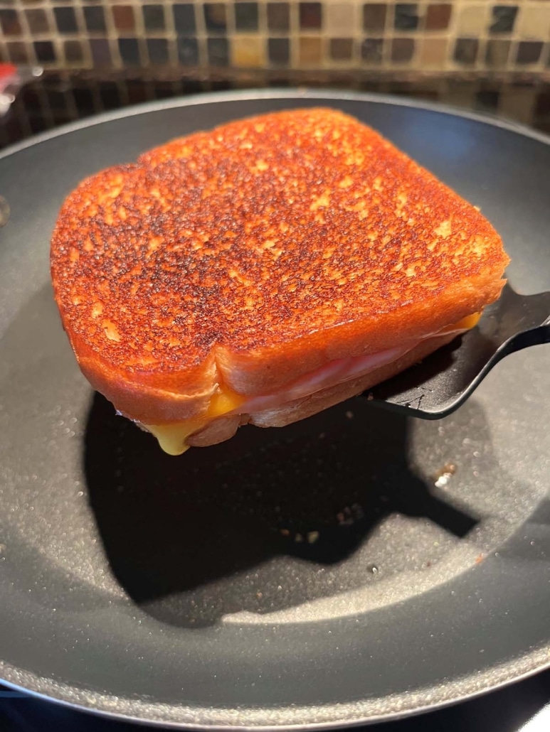 Grilled Turkey And Cheese Sandwich on a spatula