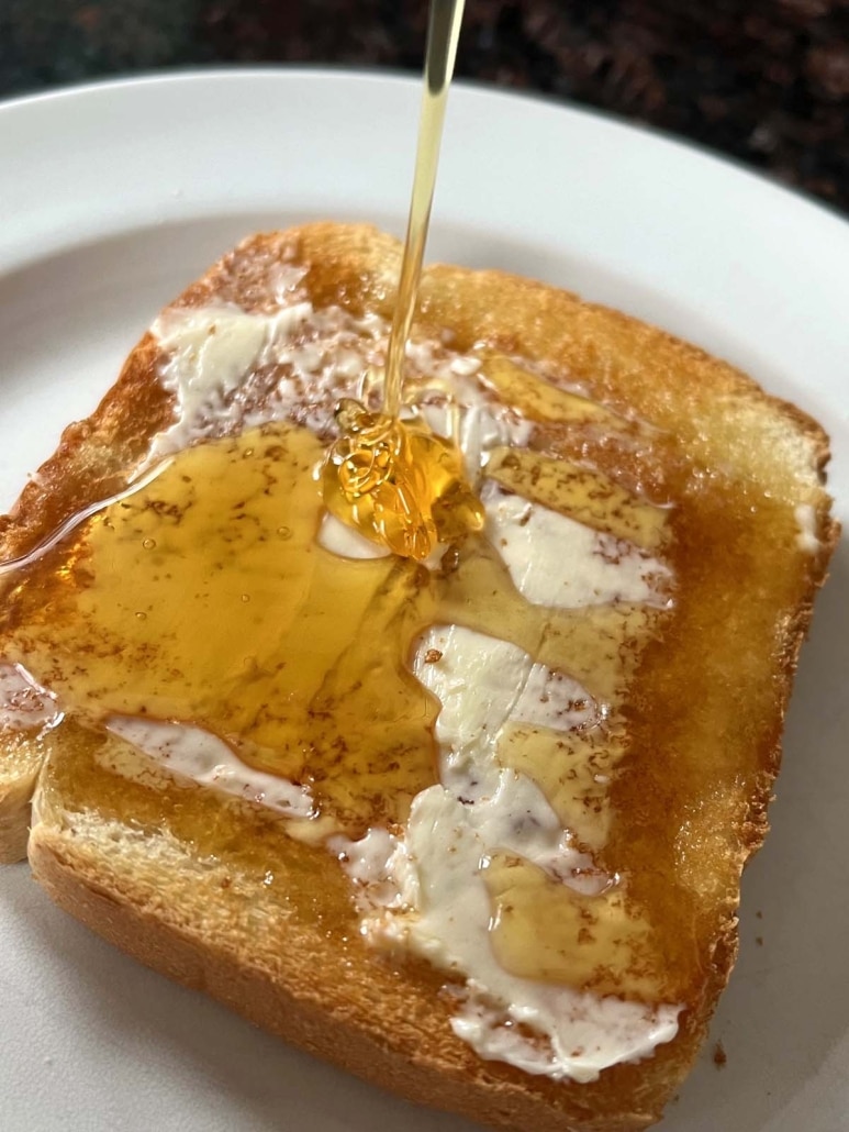 honey drizzled on buttered toast