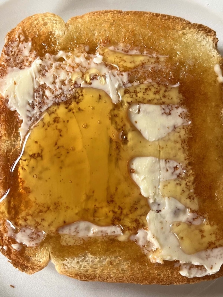 gooey honey on warm, buttered toast