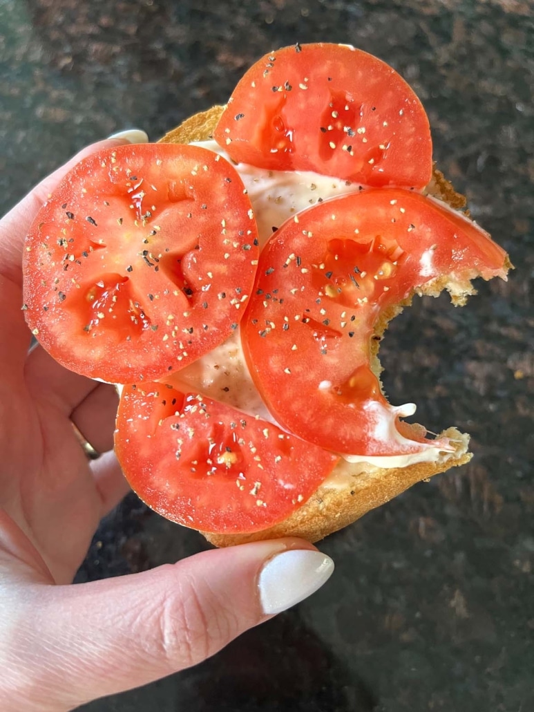 a bite taken out of Tomato Toast