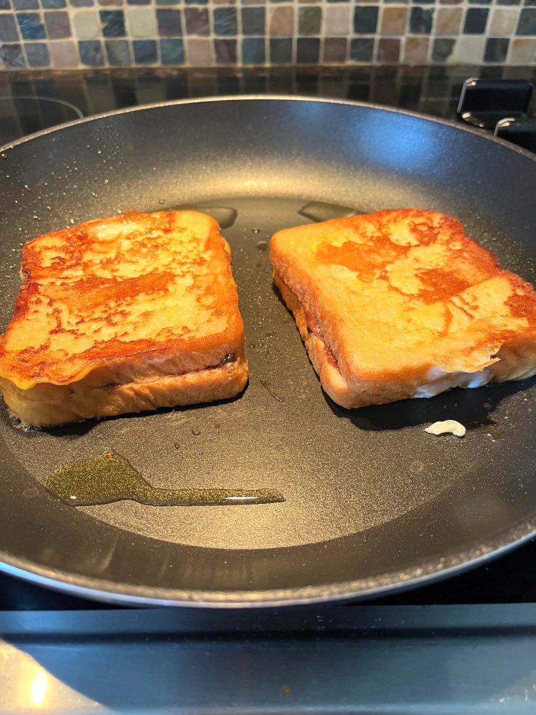 Nutella Stuffed French Toast cooking in the skillet