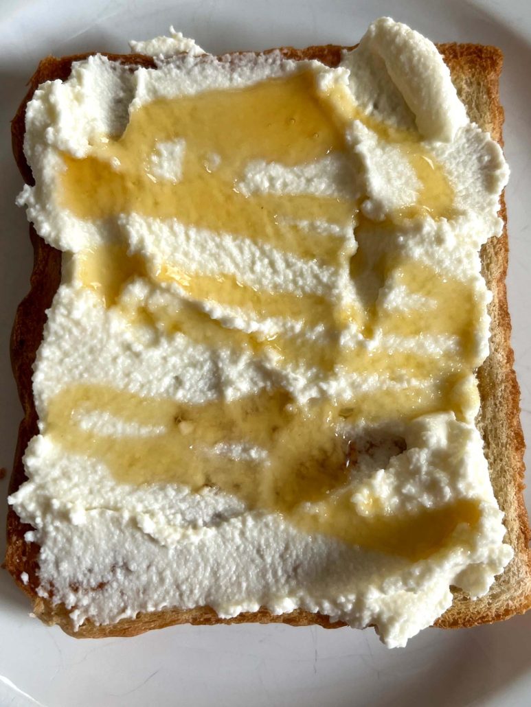 ricotta-covered toast, drizzled with honey