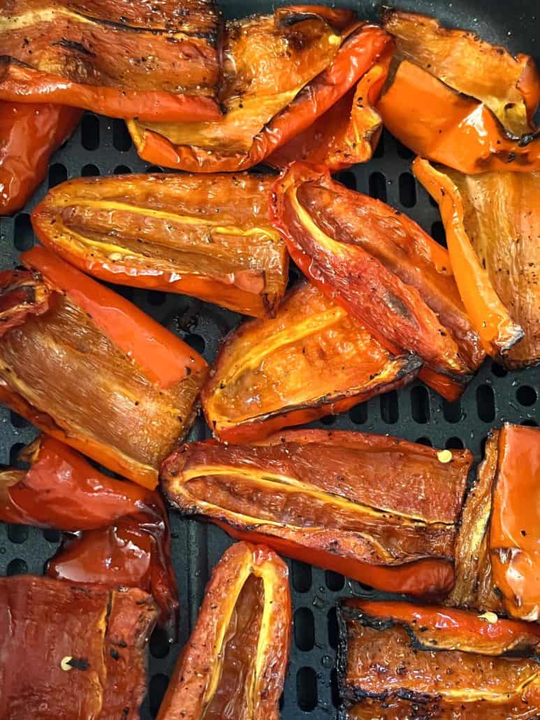Close-up of roasted ancient red sweet peppers, showing their golden-brown and perfect tenderness.