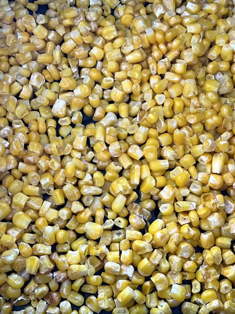 Close-up of golden, crispy air-fried corn showing the perfect texture achieved from cooking frozen corn in the air fryer.