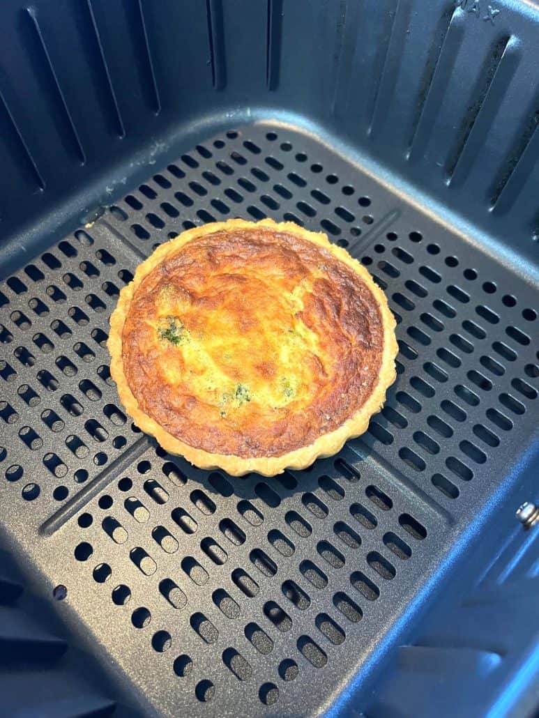 Golden, crispy quiche freshly cooked in the air fryer, showing the perfect texture achieved using the frozen quiche air fryer recipe.