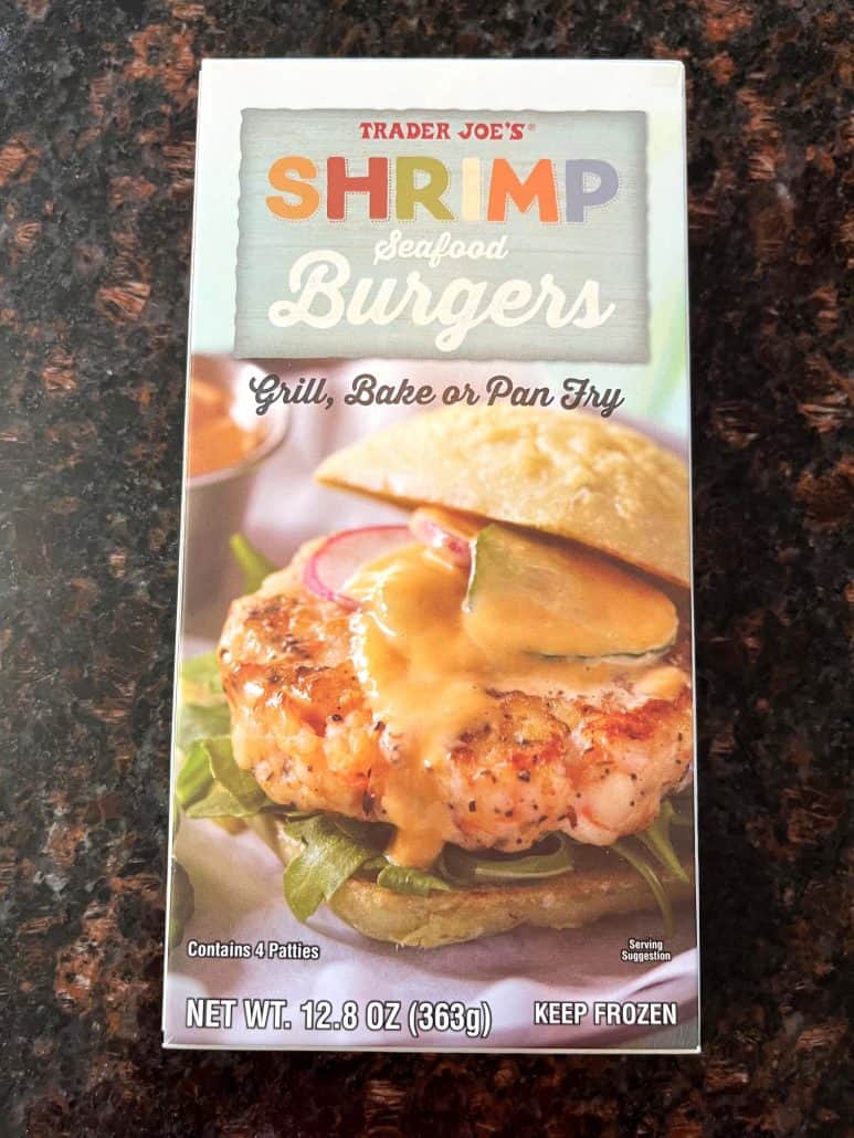 Box of Trader Joe’s Shrimp Burgers, showing a crispy shrimp patty served on a bun with fresh toppings.