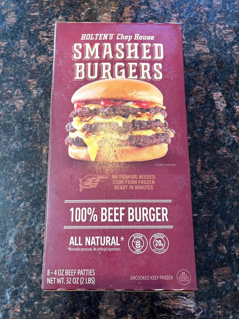 Box of frozen smashed burgers used in the air fryer recipe, showing packaging for 100% beef patties.