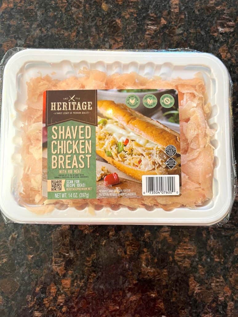 Package of Kirkwood Shaved Chicken Breast on a kitchen counter—this is the frozen chicken used in the air fryer recipe for a quick and easy meal.
