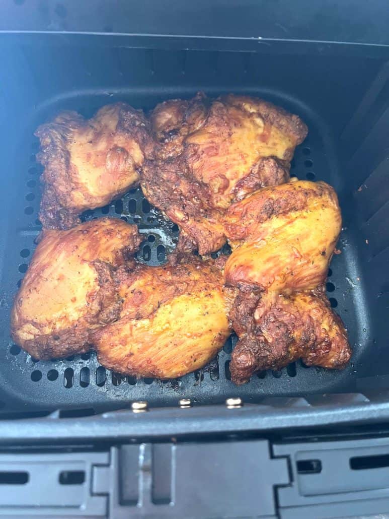 Perfectly cooked Trader Joe’s Shawarma Chicken Thighs in the air fryer basket.