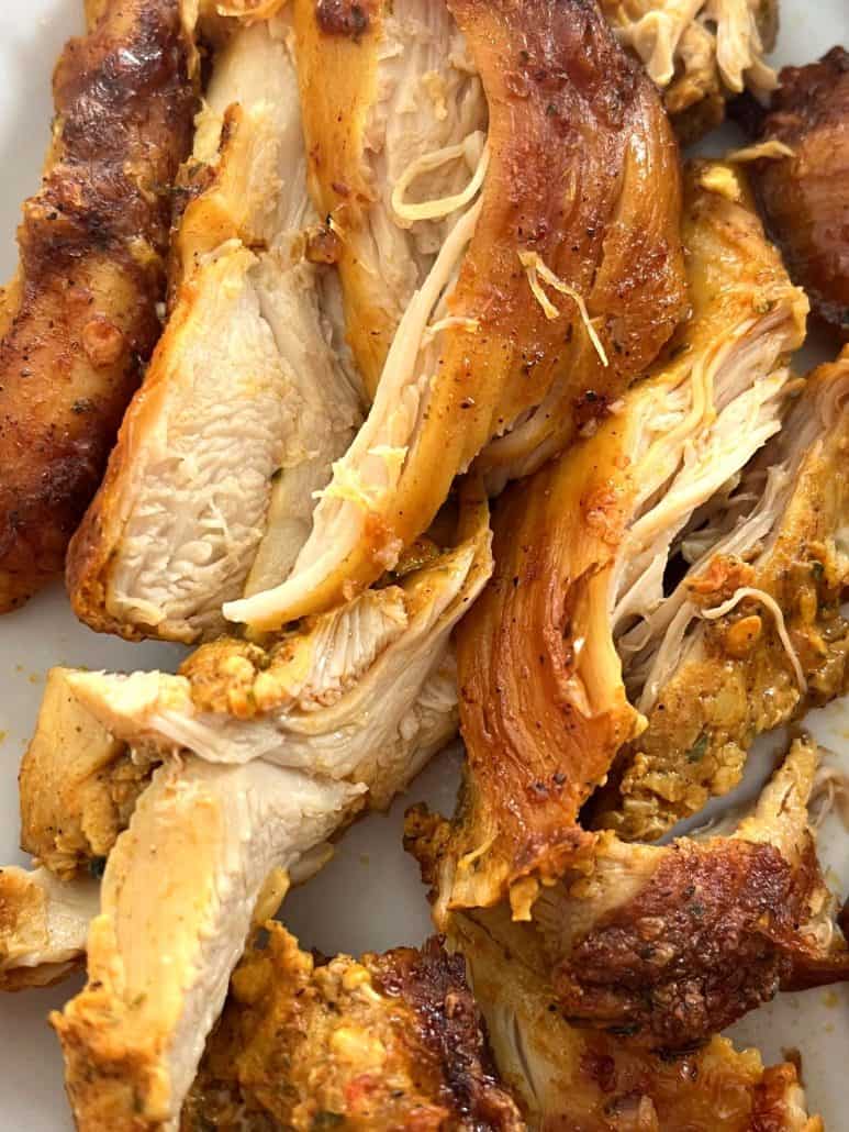 Close-up of sliced Trader Joe’s shawarma chicken thighs, showing juicy, tender meat with flavorful seasoning.