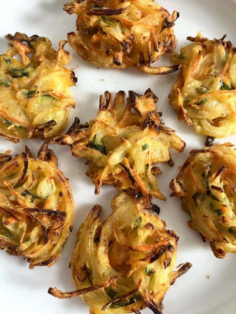 Close-up of crispy, golden-brown Trader Joe’s Vegetable Bird’s Nests on a plate, freshly cooked and ready to eat.
