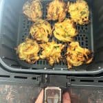 Crispy Trader Joe’s Vegetable Bird’s Nests freshly cooked in an air fryer basket.