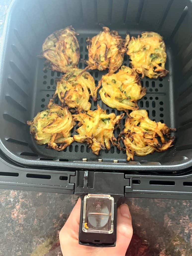 Crispy Trader Joe’s Vegetable Bird’s Nests freshly cooked in an air fryer basket.