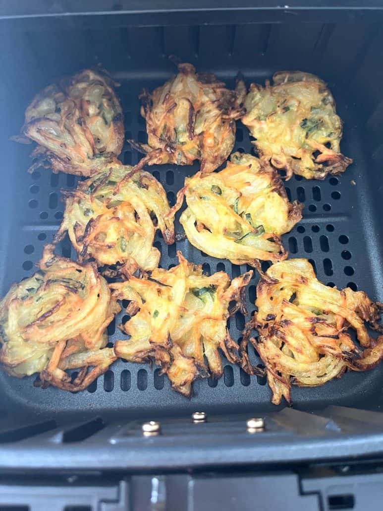 Golden brown and crispy Trader Joe’s Vegetable Bird’s Nests freshly cooked in the air fryer basket, ready to serve.