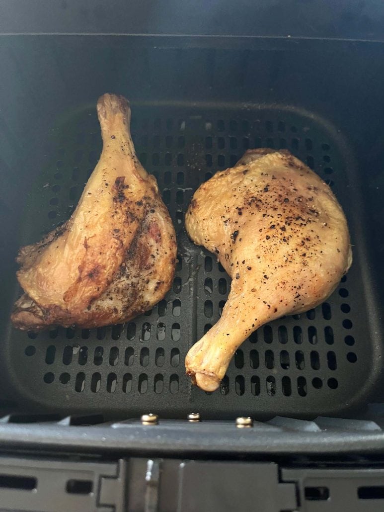Crispy air fried duck legs in the basket, perfectly cooked from the air fryer.