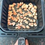 Crispy popcorn chicken freshly cooked in an air fryer basket, showing the perfect golden-brown texture for a quick and easy meal.