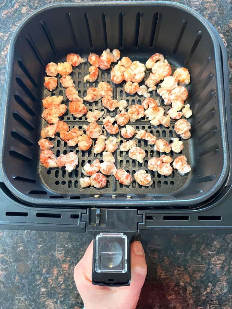 Crispy popcorn chicken freshly cooked in an air fryer basket, showing the perfect golden-brown texture for a quick and easy meal.