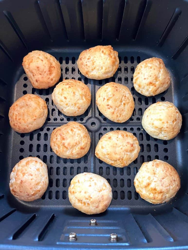 Golden brown Brazilian cheese bread cooked in the air fryer, showing the perfect result.