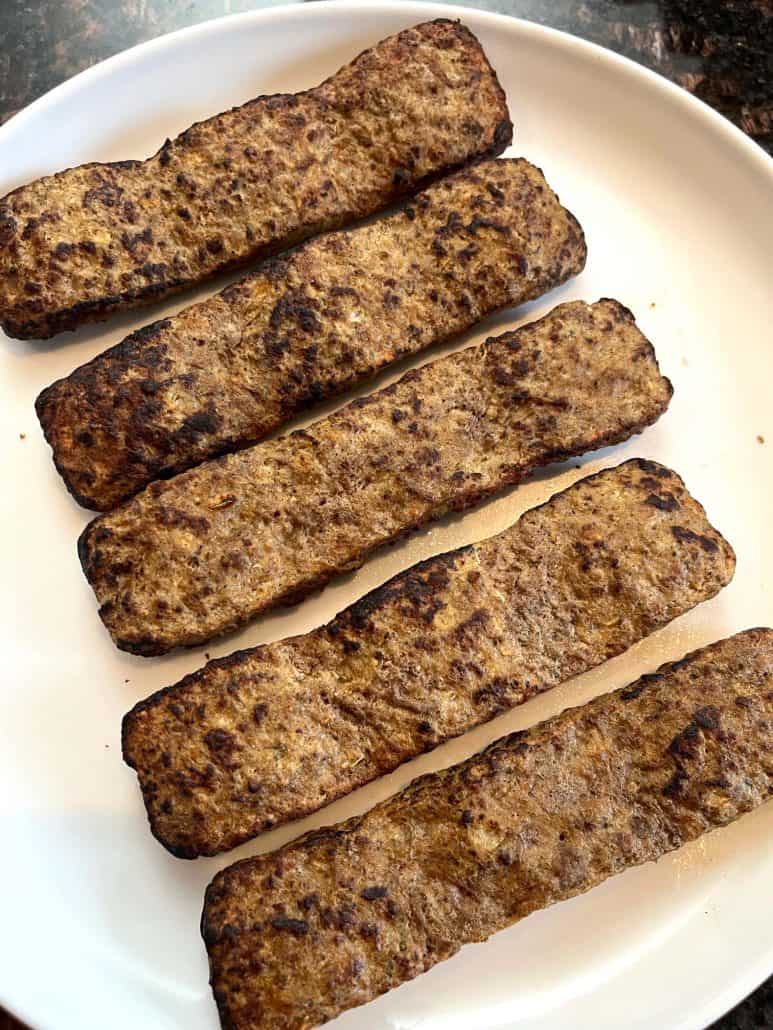 Cooked Trader Joe’s beef kabobs arranged on a plate, showing their crispy, golden-brown texture after air frying.