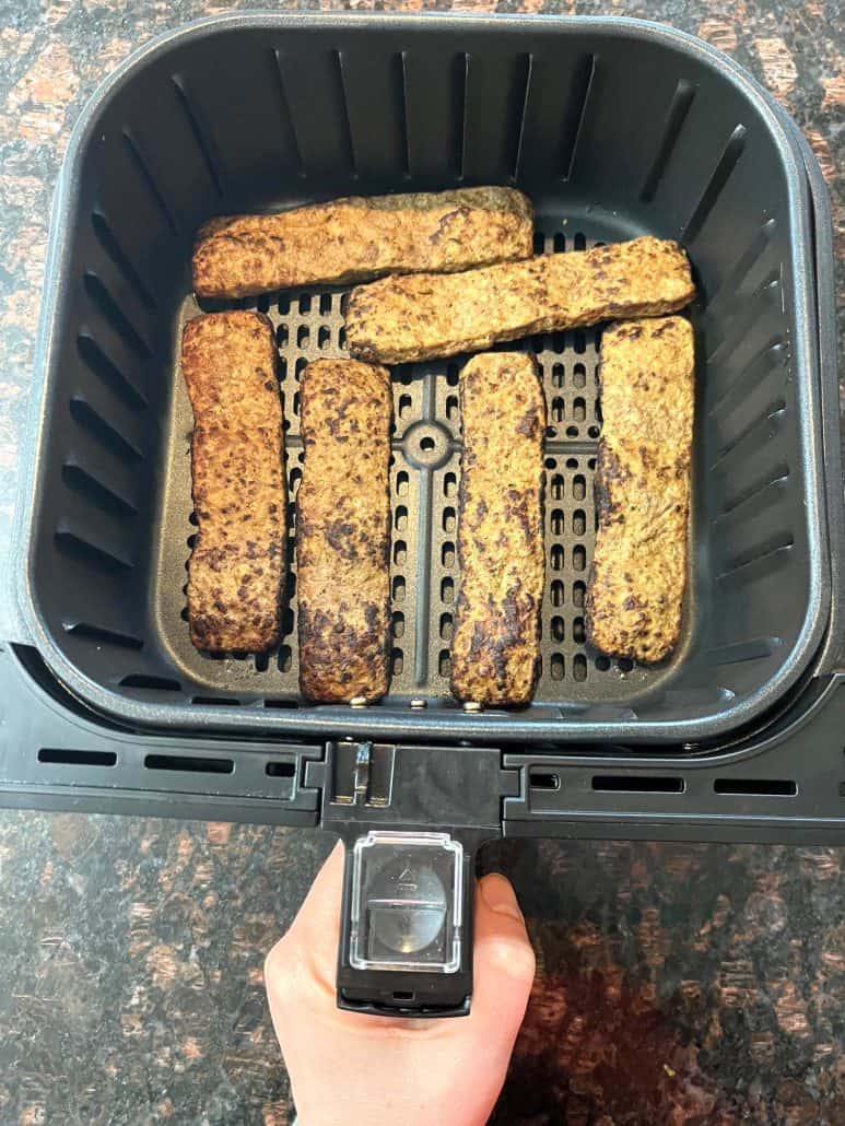 Air fryer basket filled with cooked Trader Joe’s kabobs, showing how they look when perfectly browned and ready to serve.