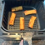 Crispy Trader Joe’s spring rolls perfectly cooked in the air fryer basket—ready to serve hot and crunchy straight from frozen.