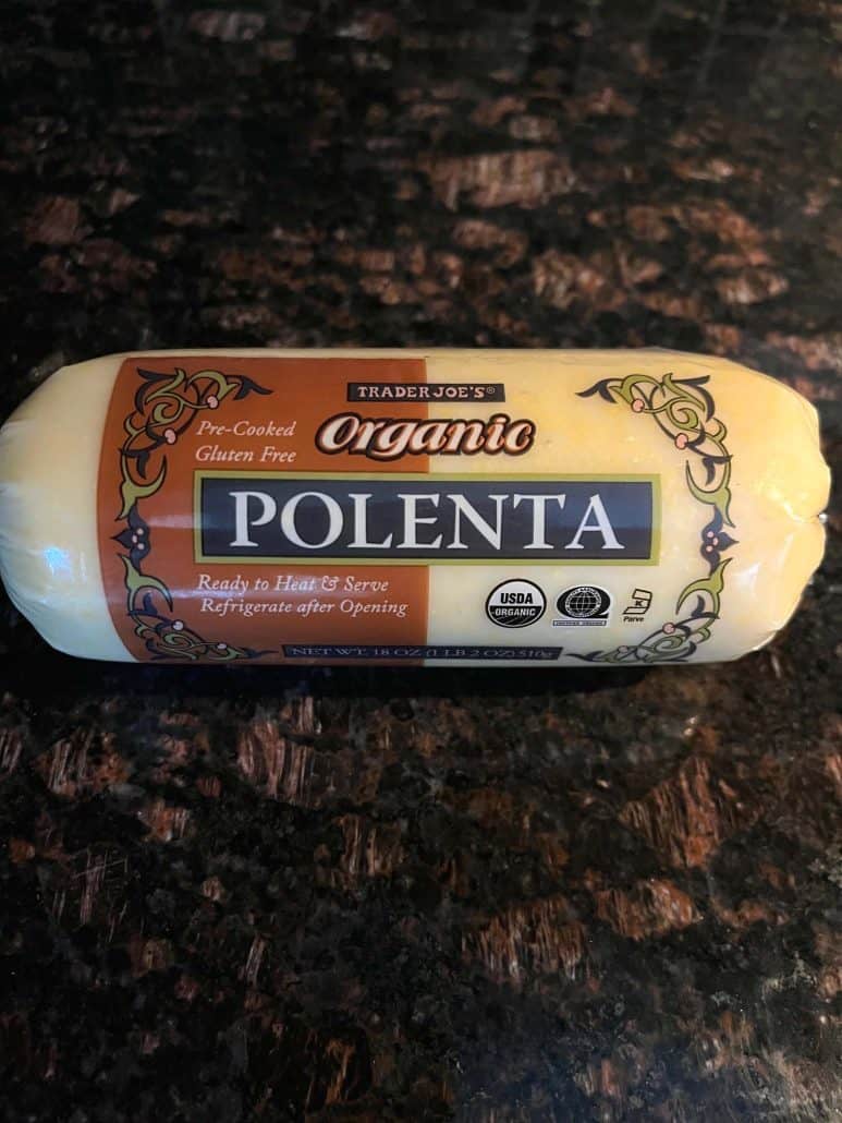 A log of pre-cooked polenta, ready to be sliced and fried, as featured in the Crispy Fried Polenta Slices recipe.