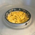 Close-up of fluffy scrambled eggs freshly cooked in the microwave, showing how easy and quick this method is.